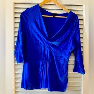 Very flattering 3/4 sleeve deep V top. Gorgeous color